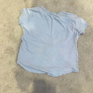 Sky blue shirt with Purple Heart and quote.